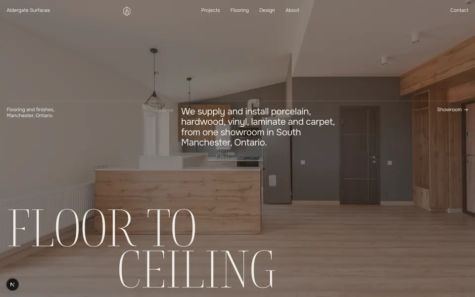 Aldergate Surfaces homepage: a dark showroom photograph with the words FLOOR TO CEILING set at full height, a materials ledger, and projects grouped by material.