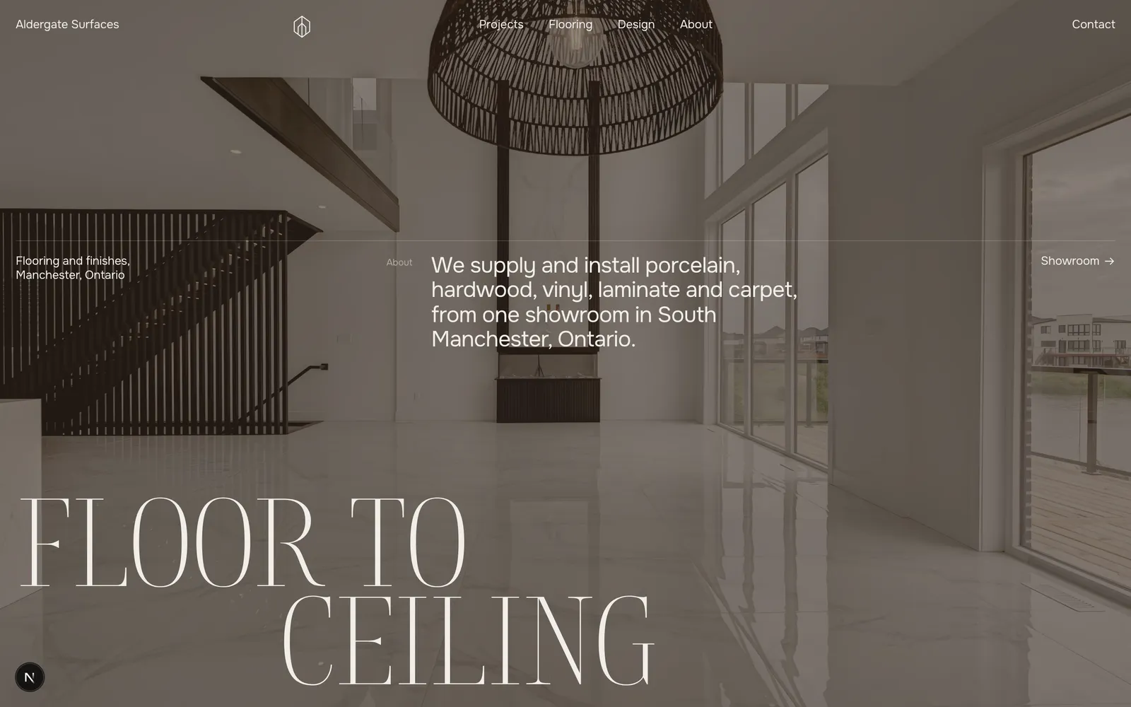 Aldergate Surfaces homepage: a dark showroom photograph with the words FLOOR TO CEILING set at full height, a materials ledger, and projects grouped by material.